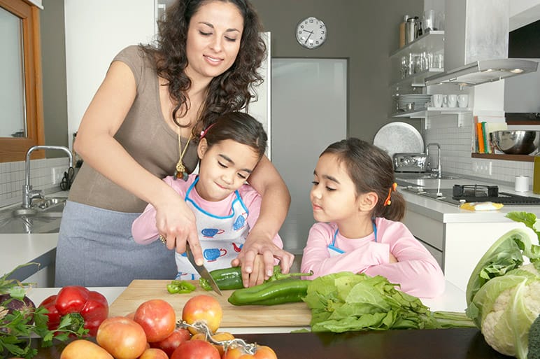 Cooking together is a family friendly activity that helps children learn. 